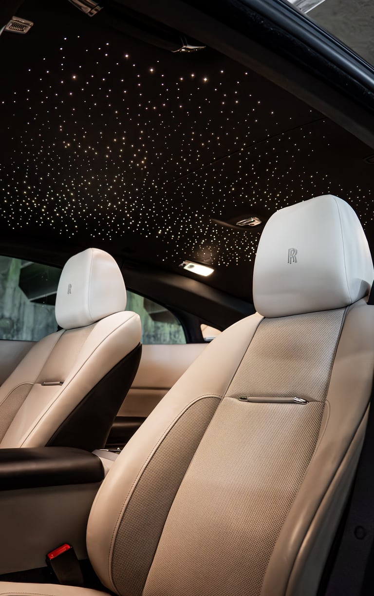 Rolls-Royce Wraith interior with beige leather seats and starlit ceiling