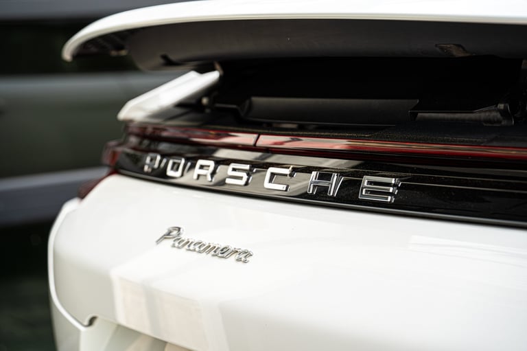 Close-up of Porsche badge and Panamera nameplate