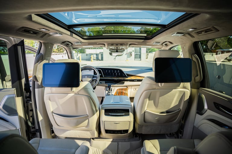Interior view of a luxury SUV with beige leather seats