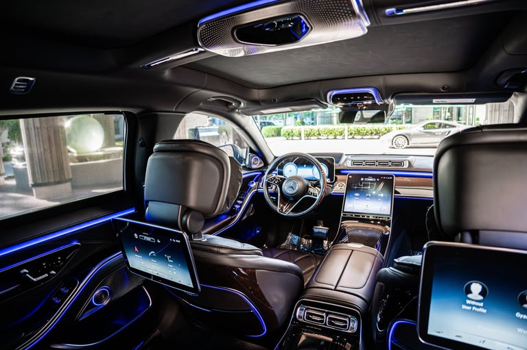 Modern luxury car interior with blue ambient lighting